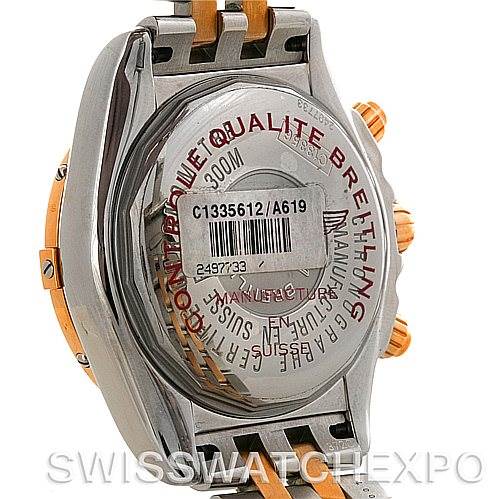 This image shows the backside of a Breitling Chronomat C13356 Men's Steel and Gold (two tone) White Dial C13356 Men's Steel and Gold (two tone) White Dial watch, highlighting its case back, serial number, and partial bracelet.