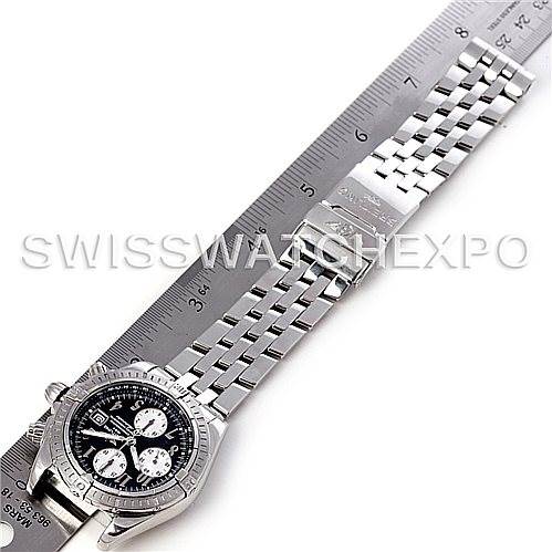 The image shows a top view of the Breitling Chronomat A13356 Men's Stainless Steel Black Dial A13356 Men's Stainless Steel Black Dial watch resting on a ruler.