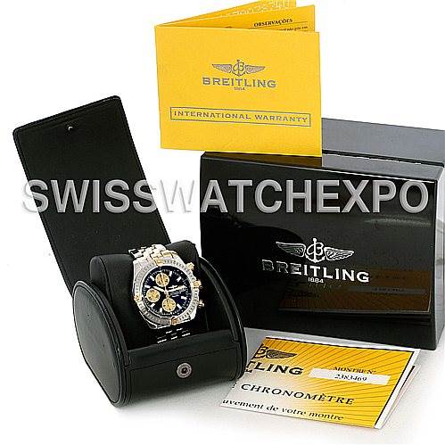The image shows a Breitling Chronomat B13356 Men's Steel and Gold (two tone) Black Dial B13356 Men's Steel and Gold (two tone) Black Dial watch in its open case, along with the warranty card, instruction booklets, and a branded box.