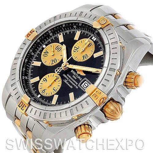 The image shows a close-up of the Breitling Chronomat B13356 Men's Steel and Gold (two tone) Black Dial B13356 Men's Steel and Gold (two tone) Black Dial watch, highlighting its dial, bezel, crown, and chronograph pushers.