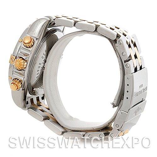The image shows the side and part of the bracelet of a Breitling Chronomat B13356 Men's Steel and Gold (two tone) Black Dial B13356 Men's Steel and Gold (two tone) Black Dial watch, highlighting the crown, pushers, and clasp.