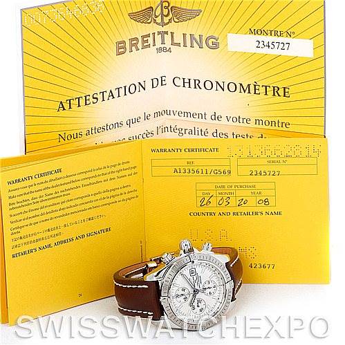 The image shows a Breitling Chronomat A13356 Men's Stainless Steel Silver Dial A13356 Men's Stainless Steel Silver Dial watch with its warranty documents and certificates.