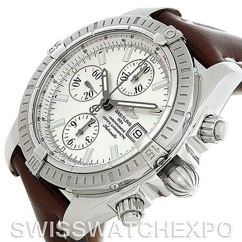 The image shows a Breitling Chronomat A13356 Men's Stainless Steel Silver Dial A13356 Men's Stainless Steel Silver Dial watch at a tilted angle, highlighting the face, crown, pushers, and part of the leather strap.