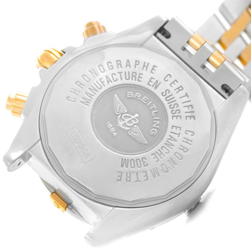 The image shows the back casing, pushers, and bracelet segment of a Breitling Chronomat B13356 Men's Steel and Gold (two tone) Black Dial B13356 Men's Steel and Gold (two tone) Black Dial watch from a side angle.
