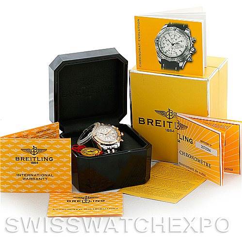 The image shows the Breitling Chronomat C13356 Men's Steel and Gold (two tone) White Dial C13356 Men's Steel and Gold (two tone) White Dial watch in its case, along with manuals, warranty cards, and accessories, viewed from the front angle.