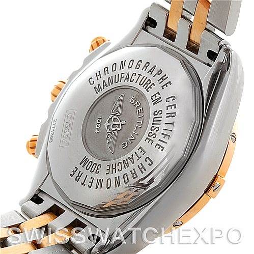 The image shows the back case of a Breitling Chronomat C13356 Men's Steel and Gold (two tone) White Dial C13356 Men's Steel and Gold (two tone) White Dial, highlighting its certification details and the two-tone bracelet.
