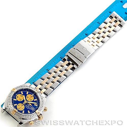 The image shows a top-down view of a Breitling Chronomat B13356 Men
s Steel and Gold (two tone) Blue Dial B13356 Men
s Steel and Gold (two tone) Blue Dial watch, highlighting the dial, bezel, and part of the bracelet.