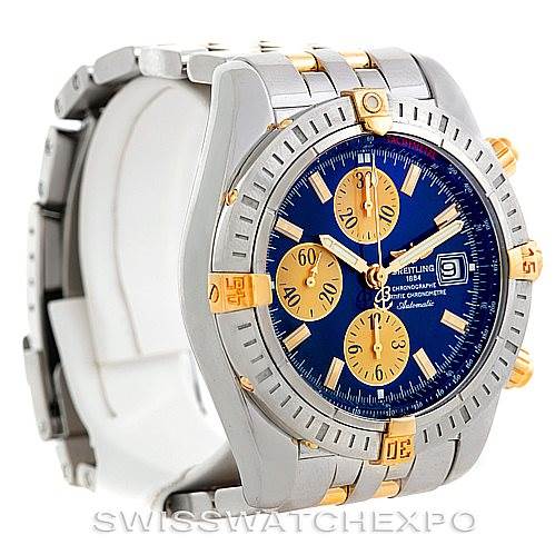 The image shows a front and slight side view of the Breitling Chronomat B13356 Men
s Steel and Gold (two tone) Blue Dial B13356 Men
s Steel and Gold (two tone) Blue Dial watch, highlighting its blue dial and gold details.