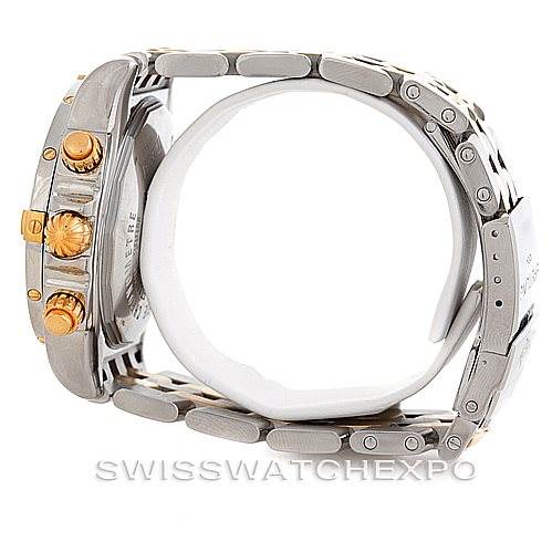 The image shows a side view of a Breitling Chronomat B13356 Men
s Steel and Gold (two tone) Blue Dial B13356 Men
s Steel and Gold (two tone) Blue Dial watch, highlighting the crown, pushers, and metal bracelet.