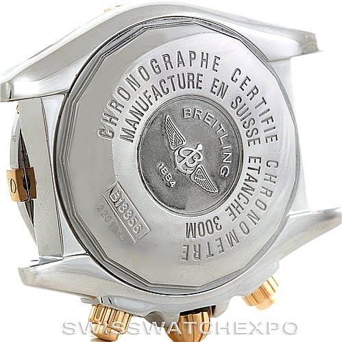 The image shows the back case and side crown of a Breitling Chronomat B13356 Men
s Steel and Gold (two tone) Blue Dial B13356 Men
s Steel and Gold (two tone) Blue Dial watch, highlighting its engravings and water resistance.