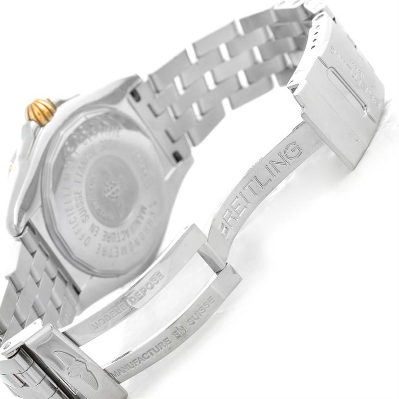 The image shows the open clasp and caseback of a Breitling Chronomat B49350 Men's Stainless Steel Mother of Pearl Dial B49350 Men's Stainless Steel Mother of Pearl Dial watch, highlighting the engraved branding.