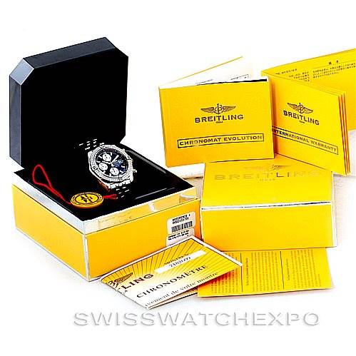 The image shows a Breitling Chronomat A13356 Men
s Stainless Steel Black Dial A13356 Men
s Stainless Steel Black Dial watch in a case with accompanying documentation and accessories from an angled top view.