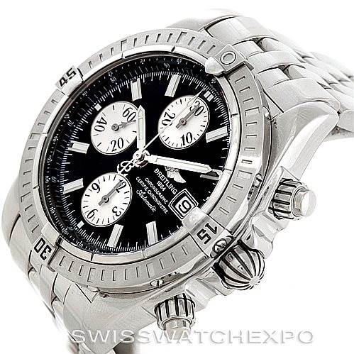The image shows a Breitling Chronomat A13356 Men
s Stainless Steel Black Dial A13356 Men
s Stainless Steel Black Dial watch from an angled perspective, highlighting the dial, bezel, and chronograph pushers.