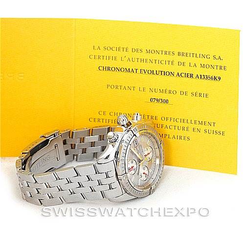 The image shows a Breitling Chronomat A13356 Men's Stainless Steel Silver Dial A13356 Men's Stainless Steel Silver Dial Evolution watch at an angle displaying its bracelet, bezel, and part of the face, accompanied by its authenticity certificate.