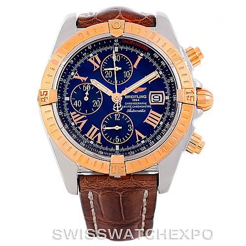 This image shows a front view of a Breitling Chronomat C13356 Men's Steel and Gold (two tone) Blue Dial C13356 Men's Steel and Gold (two tone) Blue Dial watch with a blue dial, gold bezel, and brown leather strap.