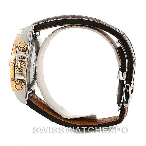The image shows a side view of the Breitling Chronomat C13356 Men's Steel and Gold (two tone) Burgundy Dial C13356 Men's Steel and Gold (two tone) Burgundy Dial watch's case, crown, pushers, and leather strap.