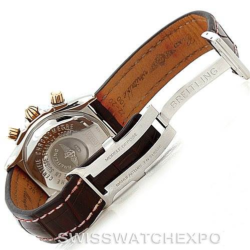 The image shows the back and clasp of a Breitling Chronomat C13356 Men's Steel and Gold (two tone) Burgundy Dial C13356 Men's Steel and Gold (two tone) Burgundy Dial watch, highlighting the leather strap and engraved buckle.