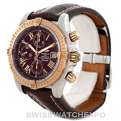 The image shows a side angle view of a Breitling Chronomat C13356 Men's Steel and Gold (two tone) Burgundy Dial C13356 Men's Steel and Gold (two tone) Burgundy Dial watch featuring a two-tone bezel, brown leather strap, and gold-tone pushers.