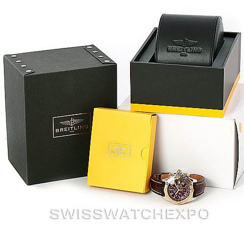 The image shows the Breitling Chronomat C13356 Men's Steel and Gold (two tone) Burgundy Dial C13356 Men's Steel and Gold (two tone) Burgundy Dial watch along with its open leather case, a yellow box, and an outer black box.