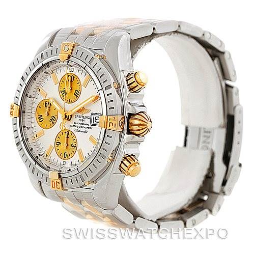 This image displays a Breitling Chronomat B13356 Men's Steel and Gold (two tone) Silver Dial B13356 Men's Steel and Gold (two tone) Silver Dial watch from a three-quarter angle, showcasing its bezel, dial, pushers, and part of the bracelet.
