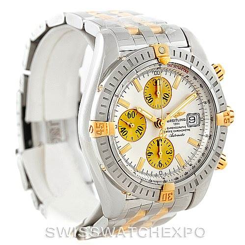 The image shows a side-angle view of a Breitling Chronomat B13356 Men's Steel and Gold (two tone) Silver Dial B13356 Men's Steel and Gold (two tone) Silver Dial watch, highlighting its two-tone metal band, bezel, and yellow chronograph dials.