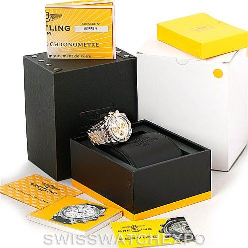 The image shows a Breitling Chronomat B13356 Men's Steel and Gold (two tone) Silver Dial B13356 Men's Steel and Gold (two tone) Silver Dial watch at an angle, along with its opened black presentation box, warranty card, manual, and additional packaging.