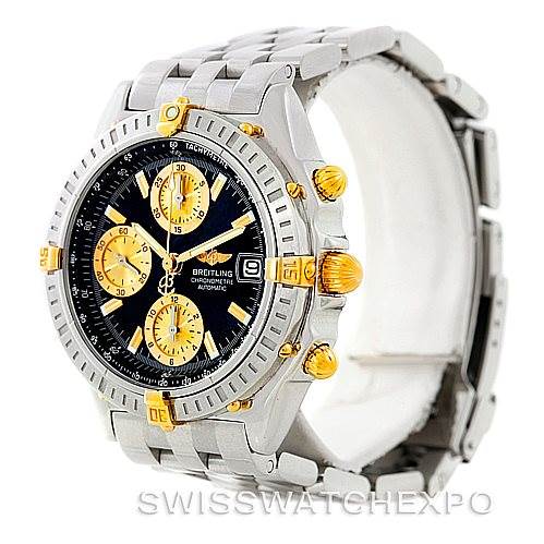 The image shows a Breitling Chronomat B13352 Men
s Steel and Gold (two tone) Black Dial B13352 Men
s Steel and Gold (two tone) Black Dial watch at an angle displaying its face, bezel, chronograph subdials, and metal bracelet.