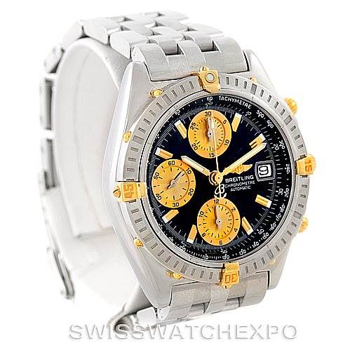 The image shows a Breitling Chronomat B13352 Men
s Steel and Gold (two tone) Black Dial B13352 Men
s Steel and Gold (two tone) Black Dial watch at a front-angle view, highlighting its face, bezel, and bracelet.