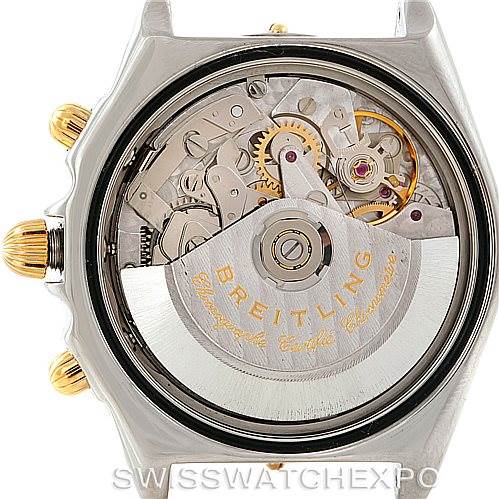 The image shows the internal mechanism and gears of a Breitling Chronomat B13352 Men
s Steel and Gold (two tone) Black Dial B13352 Men
s Steel and Gold (two tone) Black Dial watch from a rear angle with the back cover removed.