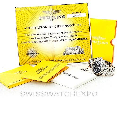 The image shows a Breitling Chronomat A13356 Men
s Stainless Steel Grey Dial A13356 Men
s Stainless Steel Grey Dial watch with a metal bracelet and various certificates and booklets from an overhead angle.