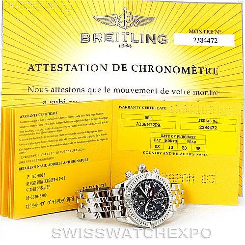 The image shows a Breitling Chronomat A13356 Men
s Stainless Steel Grey Dial A13356 Men
s Stainless Steel Grey Dial watch with its silver band and black dial, along with warranty and chronometer certification papers.