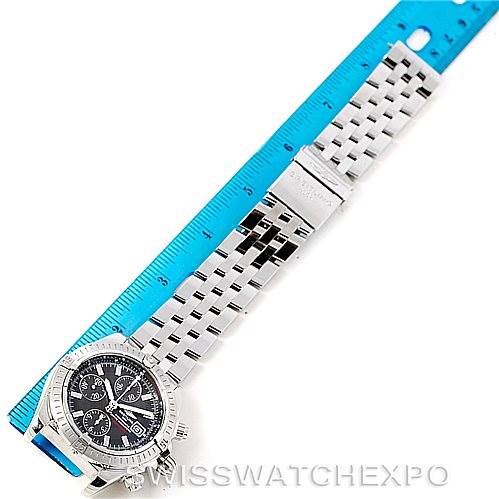 The image shows a Breitling Chronomat A13356 Men
s Stainless Steel Grey Dial A13356 Men
s Stainless Steel Grey Dial watch laid flat next to a blue ruler, displaying the dial and full metal bracelet.