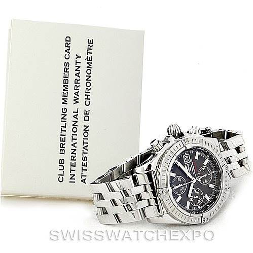 The image shows a Breitling Chronomat A13356 Men
s Stainless Steel Grey Dial A13356 Men
s Stainless Steel Grey Dial watch at an angle displaying its face, bezel, and bracelet, accompanied by warranty documentation.