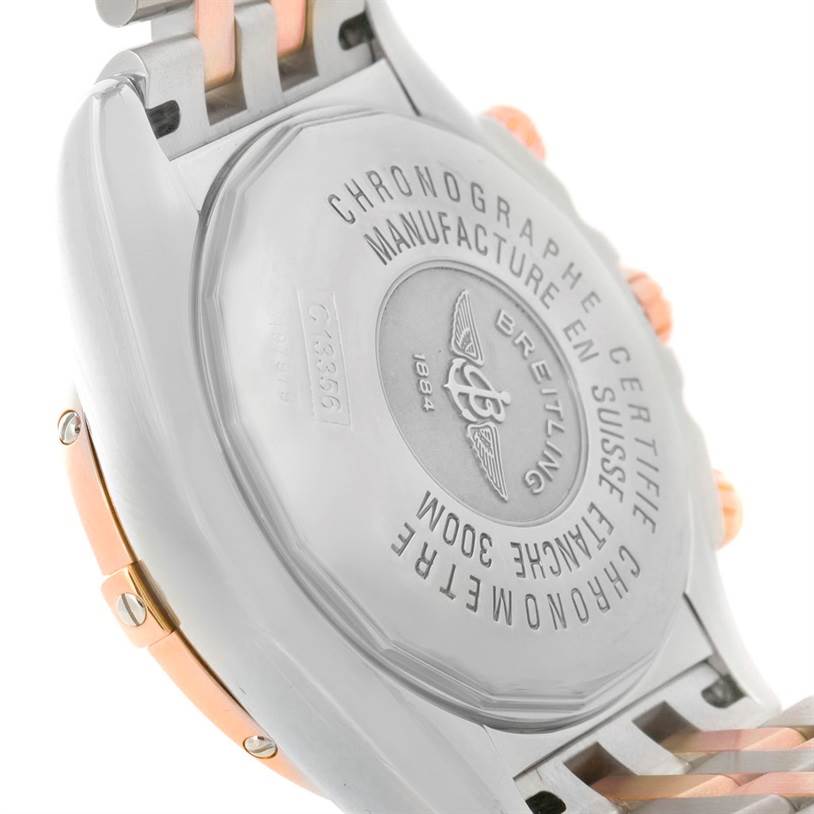 This image shows the back case of a Breitling Chronomat C13356 Men's Steel and Gold (two tone) Burgundy Dial C13356 Men's Steel and Gold (two tone) Burgundy Dial watch, highlighting engravings and part of the bracelet.