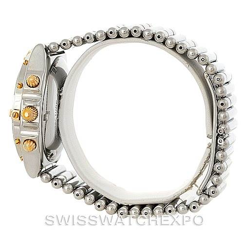 This image shows a side view of the Breitling Chronomat B13050 Men's Steel and Gold (two tone) Black Dial B13050 Men's Steel and Gold (two tone) Black Dial watch, focusing on the crown and metallic bracelet.