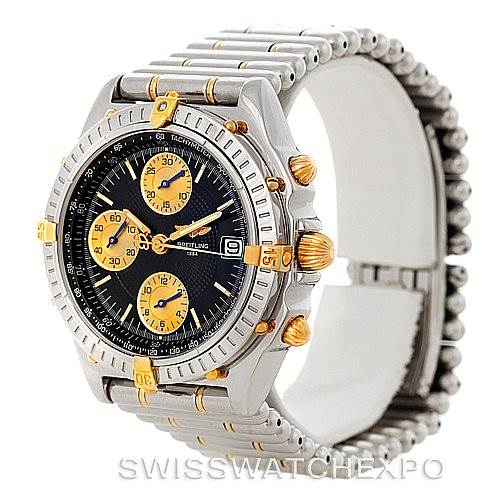 This image shows a Breitling Chronomat B13050 Men's Steel and Gold (two tone) Black Dial B13050 Men's Steel and Gold (two tone) Black Dial watch at an angled side view, highlighting the face, subdials, bezel, and metal bracelet.