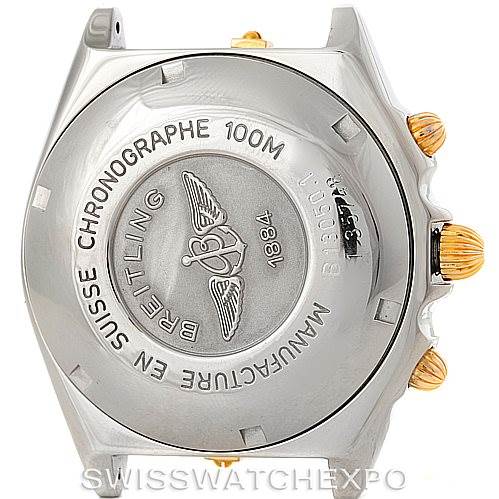 The image shows the case back and side view of a Breitling Chronomat B13050 Men's Steel and Gold (two tone) Black Dial B13050 Men's Steel and Gold (two tone) Black Dial watch, highlighting its engraved details and gold crown and pushers.