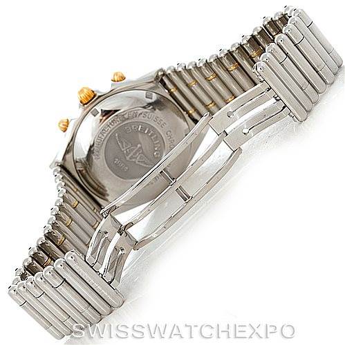 The image shows the back view of a Breitling Chronomat B13050 Men's Steel and Gold (two tone) Black Dial B13050 Men's Steel and Gold (two tone) Black Dial watch, showcasing its case back and metal bracelet.