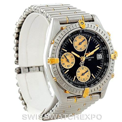 This Breitling Chronomat B13050 Men's Steel and Gold (two tone) Black Dial B13050 Men's Steel and Gold (two tone) Black Dial watch is shown at a three-quarter angle, highlighting its dial, bezel, and bracelet.