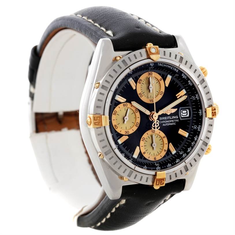The image shows a Breitling Chronomat B13352 Men
s Steel and Gold (two tone) Black Dial B13352 Men
s Steel and Gold (two tone) Black Dial watch at a slight angle highlighting the face, bezel, crown, and leather strap.