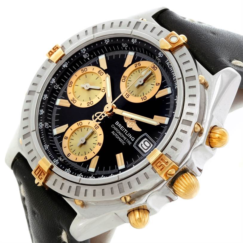 The Breitling Chronomat B13352 Men
s Steel and Gold (two tone) Black Dial B13352 Men
s Steel and Gold (two tone) Black Dial watch is shown at an oblique angle, displaying its face, bezel, push buttons, and crown.