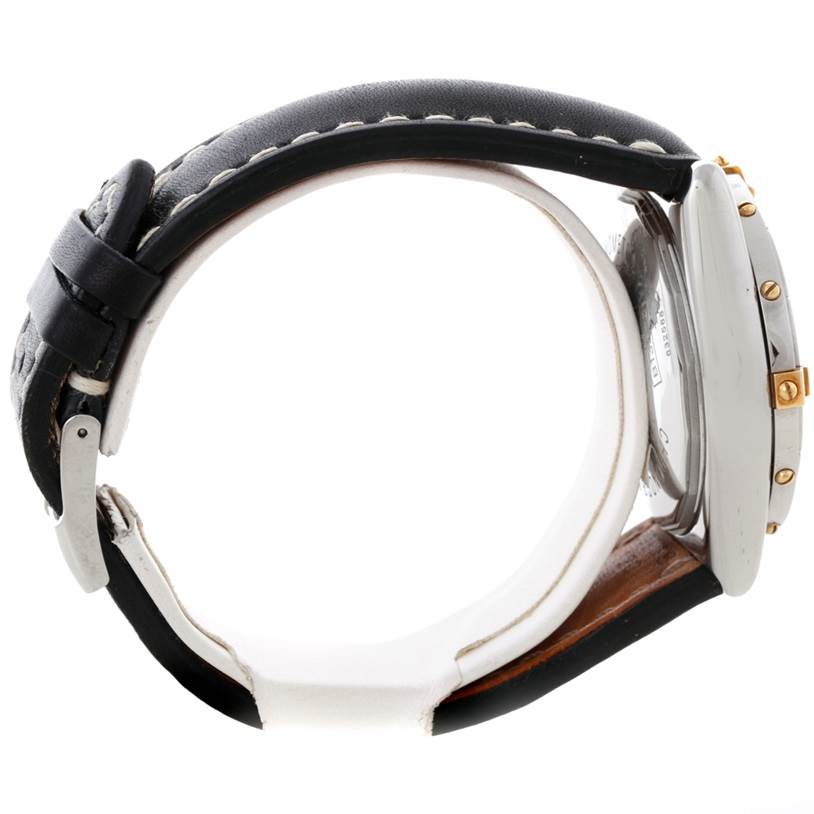 This side view shows the bezel, crown, and leather strap of the Breitling Chronomat B13352 Men
s Steel and Gold (two tone) Black Dial B13352 Men
s Steel and Gold (two tone) Black Dial watch.
