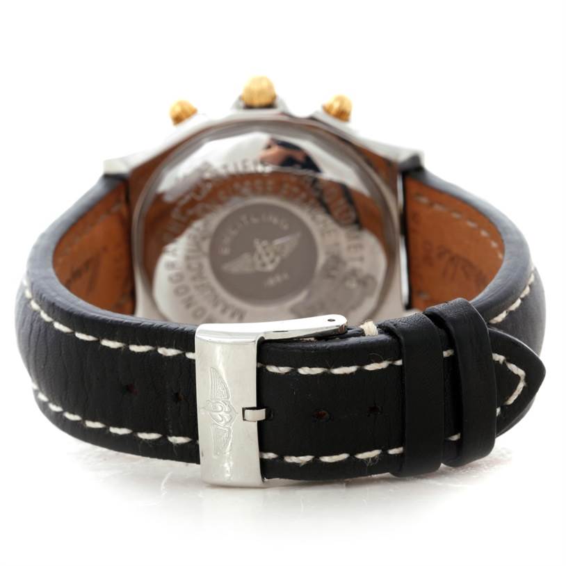 The image shows the back and buckle of a Breitling Chronomat B13352 Men
s Steel and Gold (two tone) Black Dial B13352 Men
s Steel and Gold (two tone) Black Dial watch, highlighting the leather strap and engraved case back.