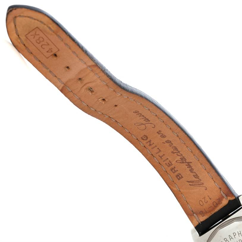 The image shows an angled view of the underside of a leather strap on a Breitling Chronomat B13352 Men
s Steel and Gold (two tone) Black Dial B13352 Men
s Steel and Gold (two tone) Black Dial watch.