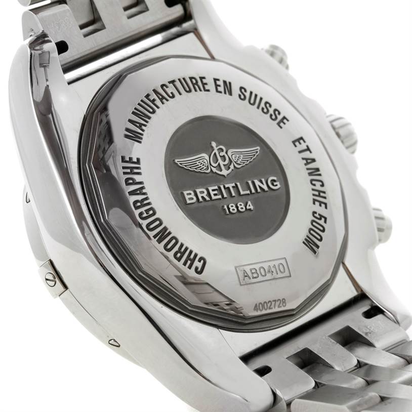 The image shows the back casing and part of the bracelet of a Breitling Chronomat AB0410 Men's Stainless Steel Silver Dial AB0410 Men's Stainless Steel Silver Dial watch, highlighting the engraved branding and model details.