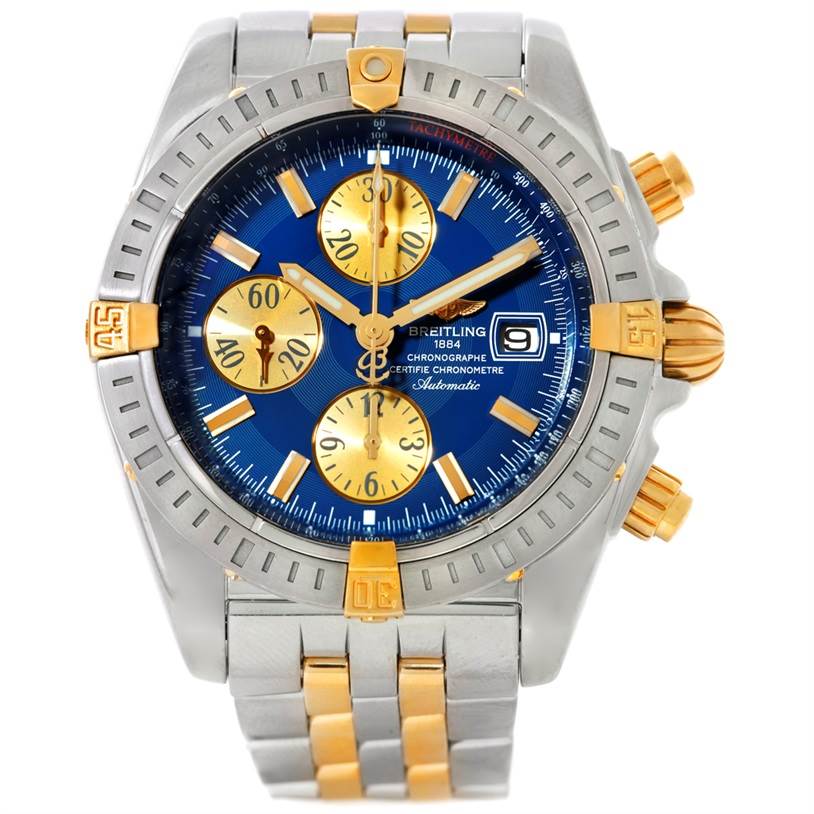 The Breitling Chronomat B13356 Men's Steel and Gold (two tone) Blue Dial B13356 Men's Steel and Gold (two tone) Blue Dial watch is shown from a frontal angle, highlighting its blue dial, gold subdials, and stainless steel and gold bracelet.