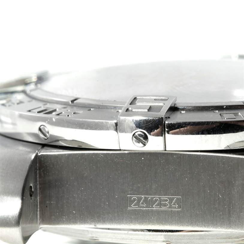 The image shows a close-up side view of the bezel and part of the case of a Breitling Chronomat A44360 Men
s Stainless Steel Black Dial A44360 Men
s Stainless Steel Black Dial watch, including screws and a model number engraving.