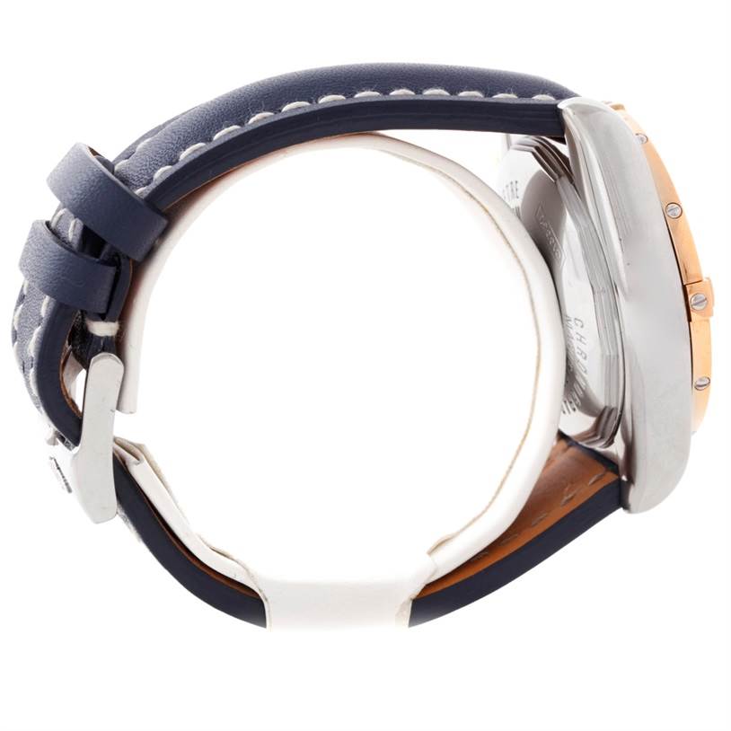 The image shows a Breitling Chronomat C13356 Men
s Steel and Gold (two tone) White Dial C13356 Men
s Steel and Gold (two tone) White Dial watch from a side view, highlighting its case back, bezel, and leather strap.