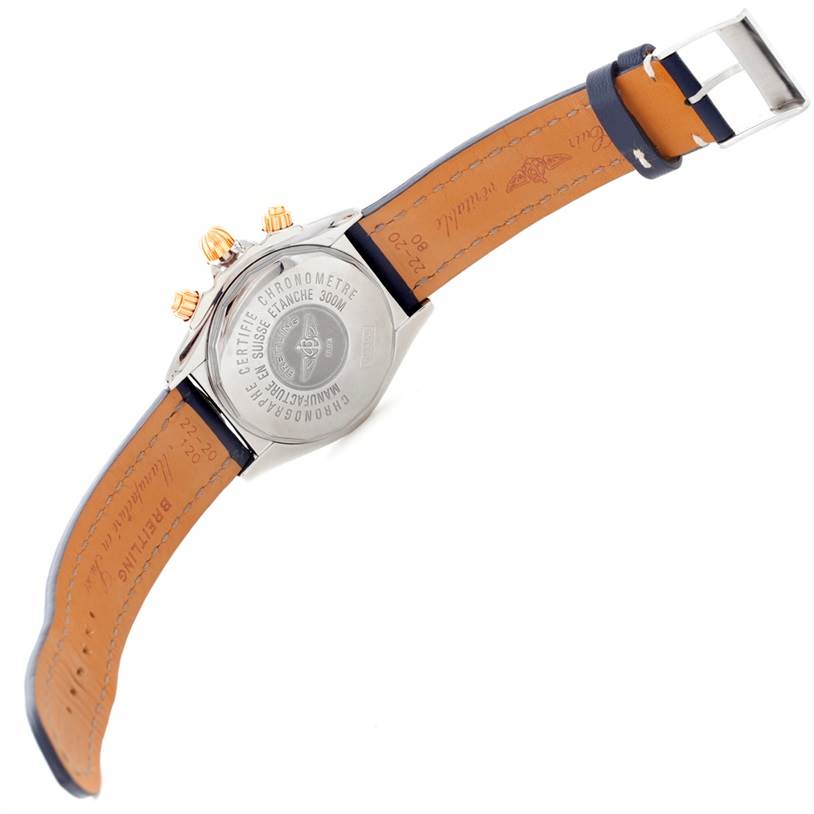 The image shows the back view of the Breitling Chronomat C13356 Men
s Steel and Gold (two tone) White Dial C13356 Men
s Steel and Gold (two tone) White Dial watch, highlighting the case back and leather strap.