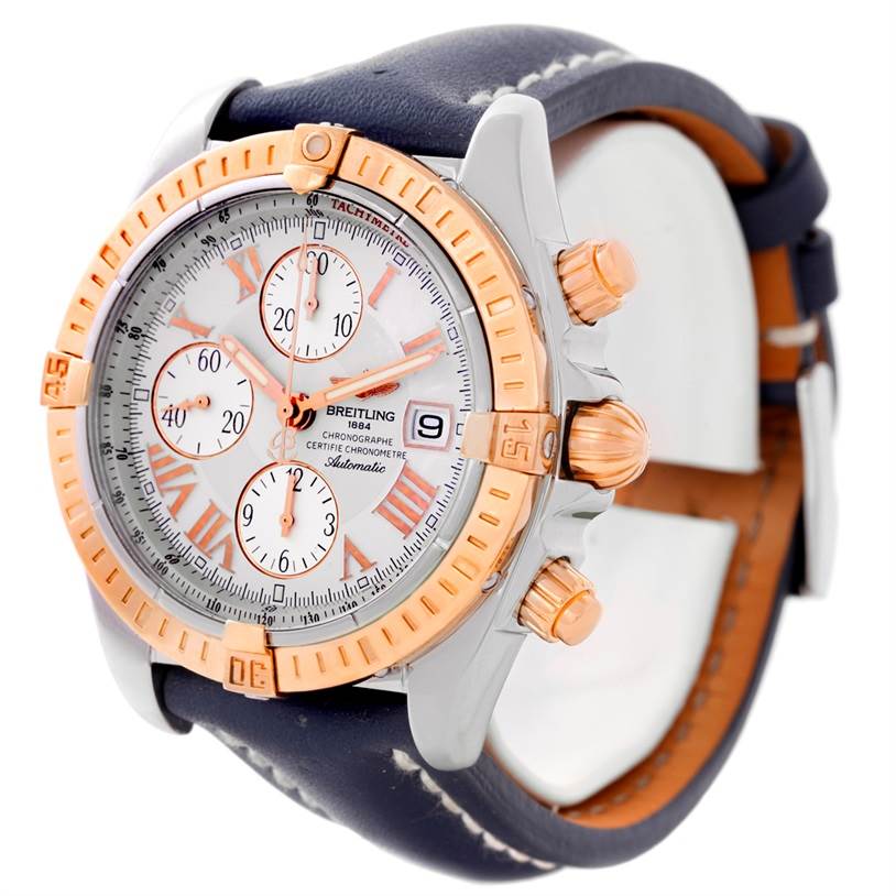 The image shows a side angle of the Breitling Chronomat C13356 Men
s Steel and Gold (two tone) White Dial C13356 Men
s Steel and Gold (two tone) White Dial watch, highlighting the face, bezel, and side pushers.